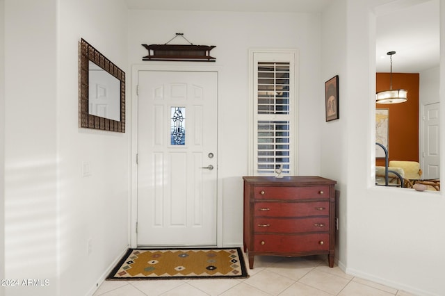 entryway with light tile patterned flooring