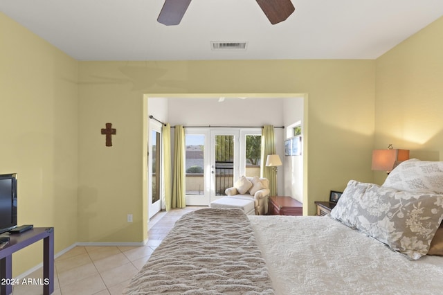 tiled bedroom featuring access to exterior, french doors, and ceiling fan