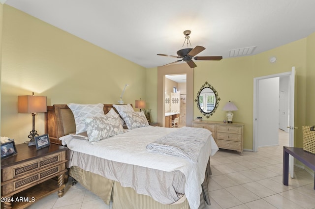 tiled bedroom with ceiling fan and connected bathroom