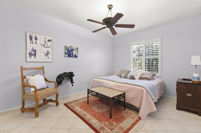 tiled bedroom featuring ceiling fan