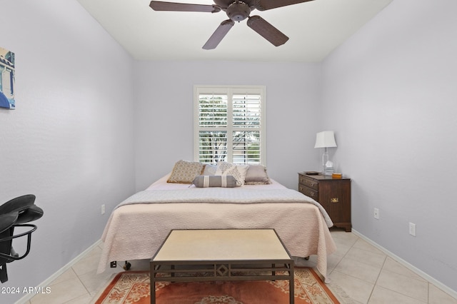 tiled bedroom with ceiling fan