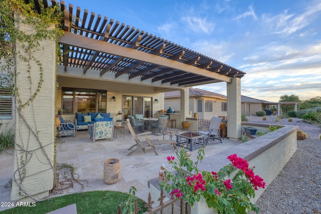 view of patio featuring a pergola and an outdoor living space