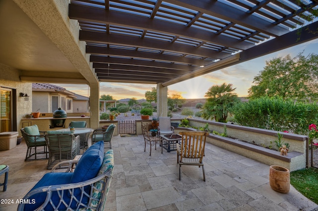 patio terrace at dusk with a pergola