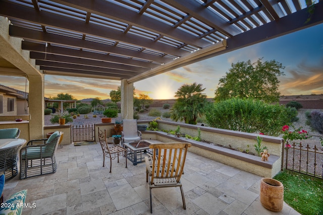 patio terrace at dusk with a pergola