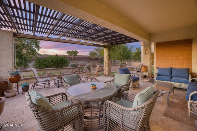 patio terrace at dusk featuring outdoor lounge area and a pergola