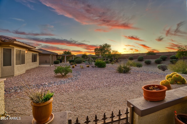 yard at dusk with a patio