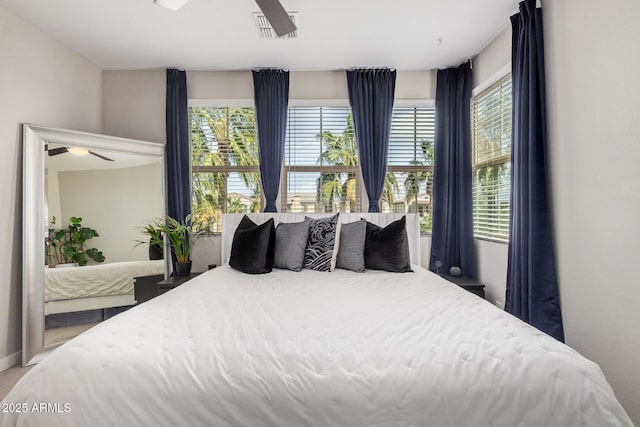 bedroom with multiple windows and visible vents