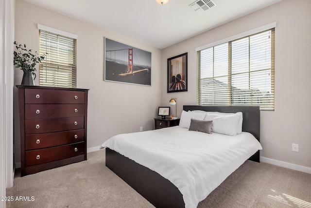 bedroom featuring carpet, visible vents, and baseboards