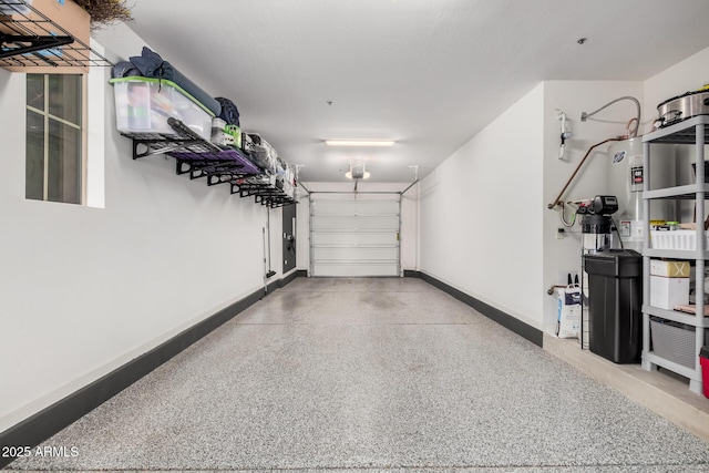 garage featuring baseboards