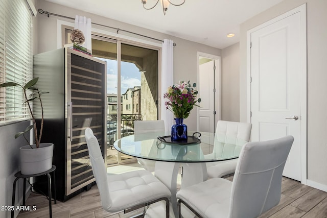 dining room with light wood-type flooring and baseboards