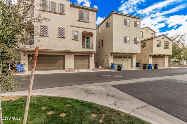 view of front of property featuring a garage and stucco siding