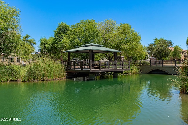 view of dock featuring a water view and a gazebo