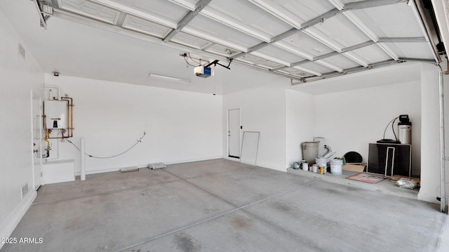 garage with water heater, visible vents, and a garage door opener