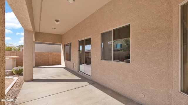 view of patio featuring fence