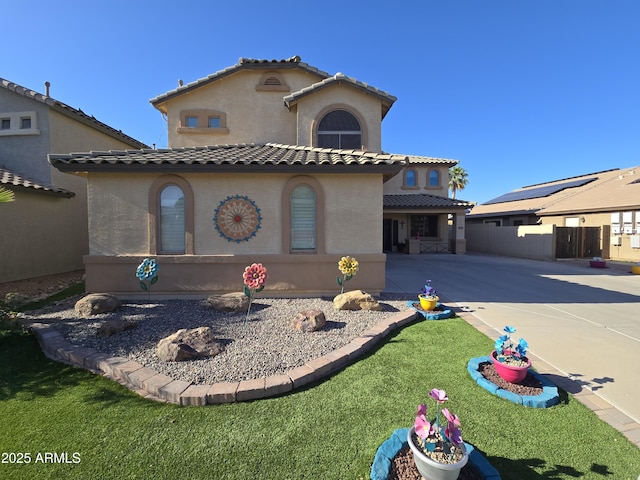 16210 W Durango St, Goodyear, AZ 85338 - mediterranean / spanish house featuring stucco siding, a tile roof, driveway, and a garage