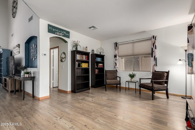 16210 W Durango St, Goodyear, AZ 85338 - living area with arched walkways and wood finished floors