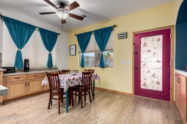 16210 W Durango St, Goodyear, AZ 85338 - dining space featuring a ceiling fan and light wood finished floors