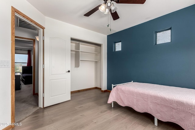 16210 W Durango St, Goodyear, AZ 85338 - bedroom featuring a closet, wood finished floors, and ceiling fan