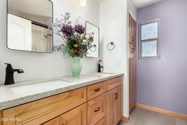 16210 W Durango St, Goodyear, AZ 85338 - full bath featuring double vanity and wood finished floors