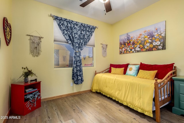 16210 W Durango St, Goodyear, AZ 85338 - bedroom featuring wood finished floors and a ceiling fan