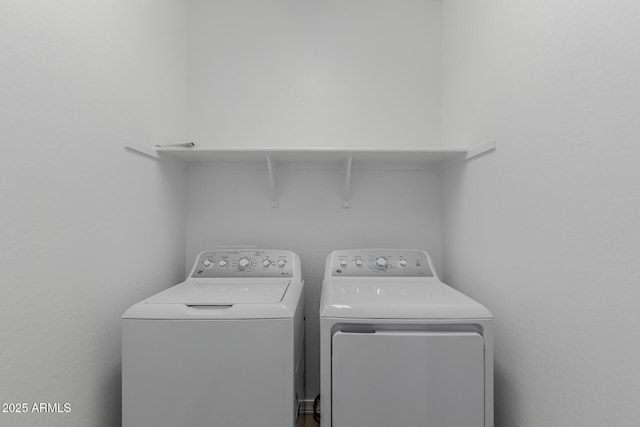 laundry room with separate washer and dryer