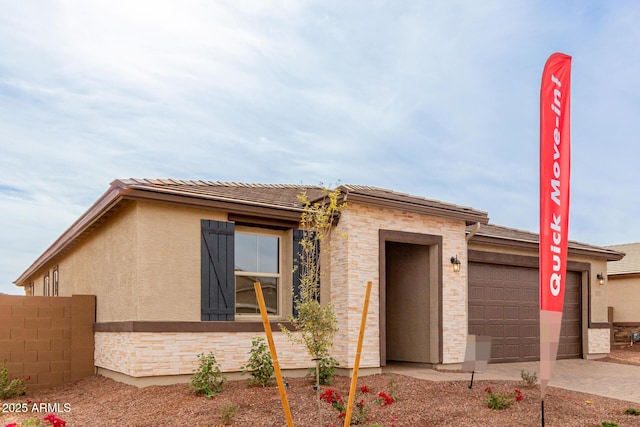 view of front of property with a garage