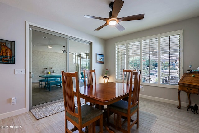 dining space with a healthy amount of sunlight and ceiling fan