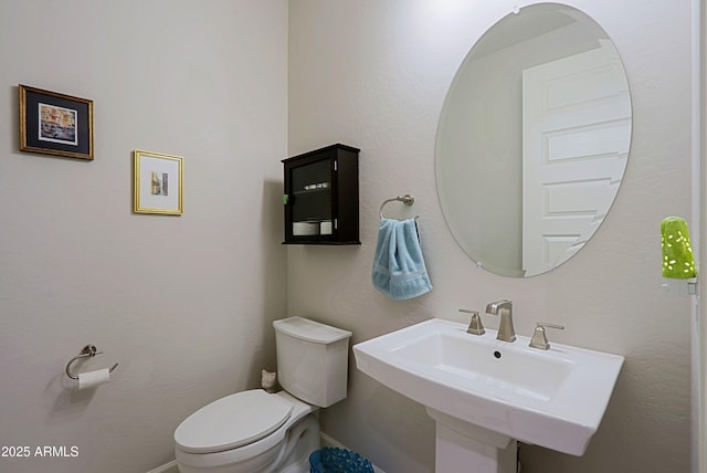 bathroom with sink and toilet