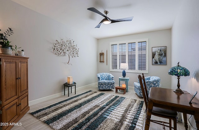 sitting room featuring light hardwood / wood-style flooring and ceiling fan