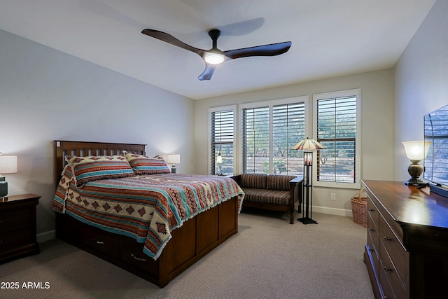 bedroom with light carpet and ceiling fan