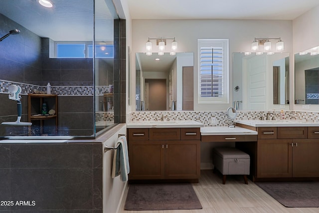 bathroom with walk in shower, vanity, hardwood / wood-style floors, and backsplash