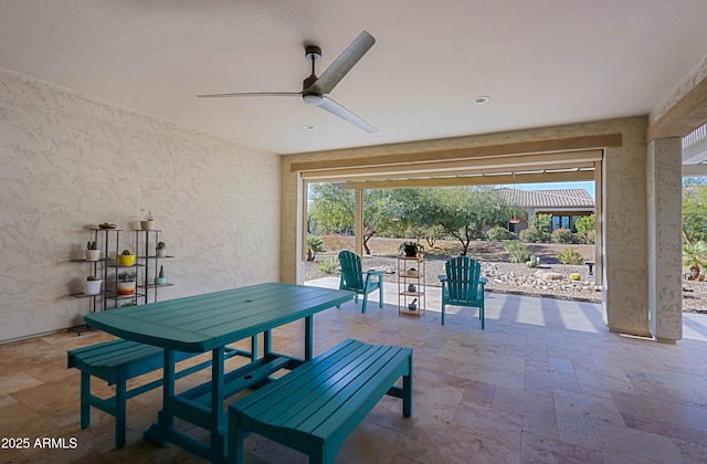 view of patio featuring ceiling fan