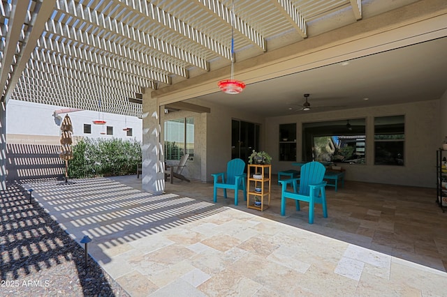 view of patio featuring ceiling fan and a pergola