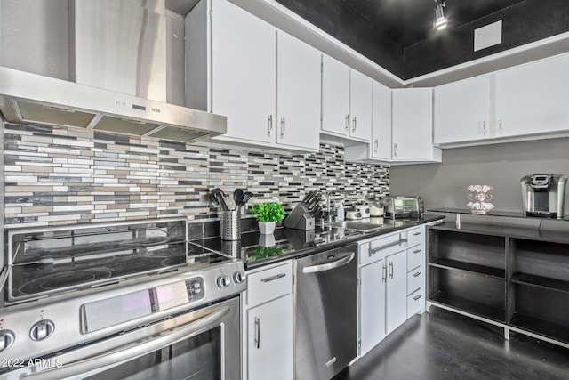 kitchen with a sink, white cabinets, appliances with stainless steel finishes, range hood, and dark countertops