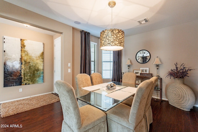 dining space with dark hardwood / wood-style flooring