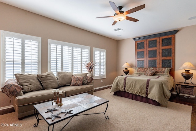 bedroom featuring wood-type flooring and ceiling fan