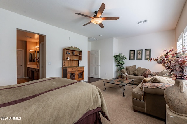 bedroom featuring ceiling fan, carpet floors, and ensuite bathroom