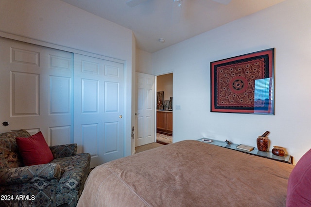 bedroom featuring carpet flooring, ceiling fan, and a closet