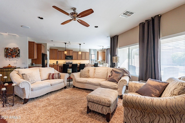 living room with ceiling fan