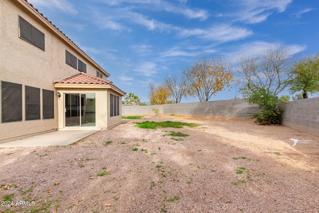 view of yard with a patio and a fenced backyard