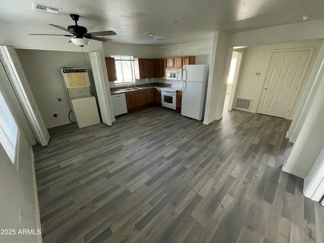 kitchen with dark hardwood / wood-style flooring, sink, ceiling fan, and white appliances