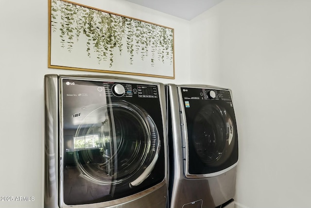 laundry area featuring washer and dryer and laundry area