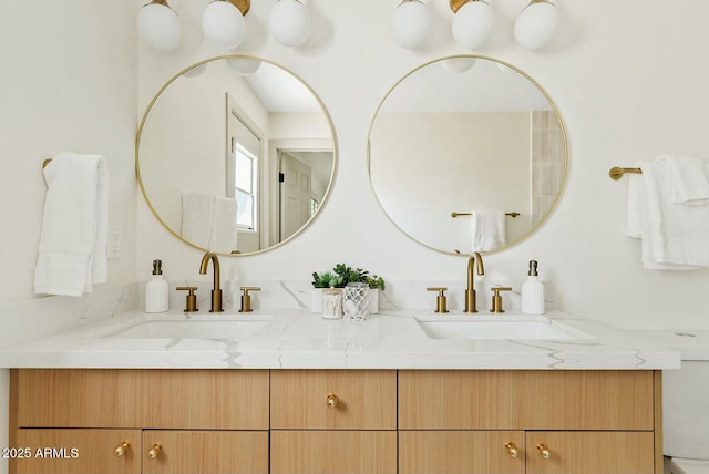 bathroom with double vanity and a sink