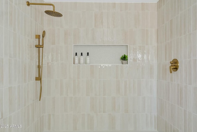 full bathroom with tiled shower