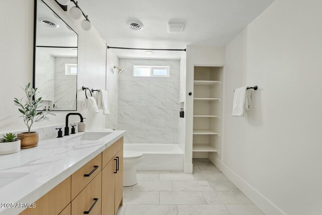 bathroom with a sink, shower / bath combination, toilet, double vanity, and visible vents