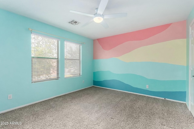 carpeted empty room featuring ceiling fan and vaulted ceiling