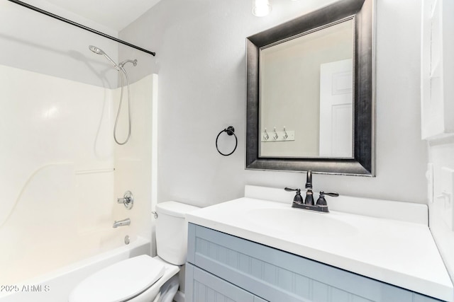 full bathroom featuring shower / bath combination, vanity, and toilet