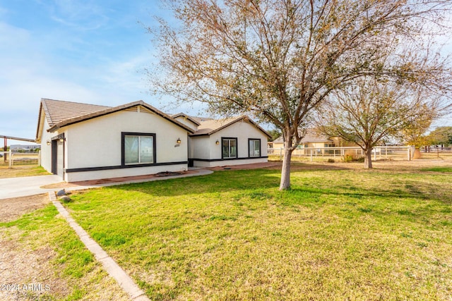 ranch-style house featuring a front lawn