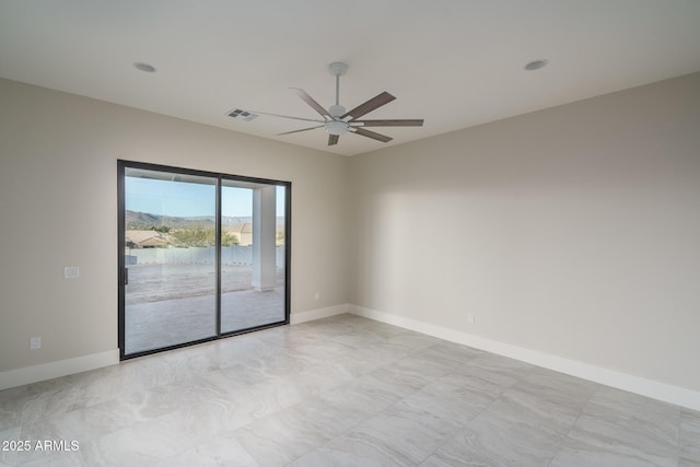 spare room featuring ceiling fan