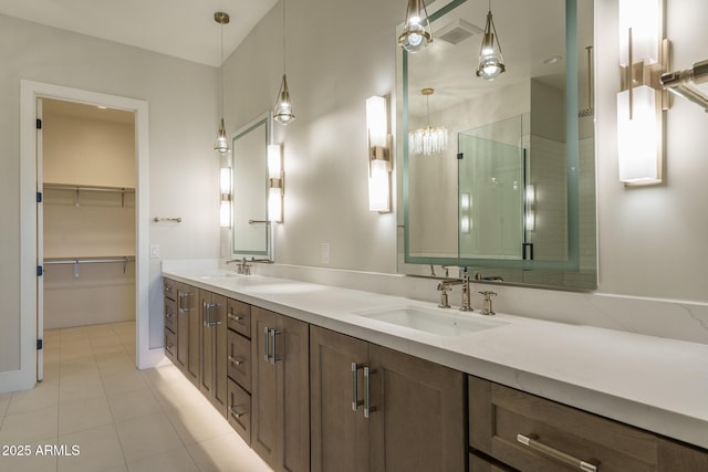 bathroom with vanity, tile patterned floors, and walk in shower